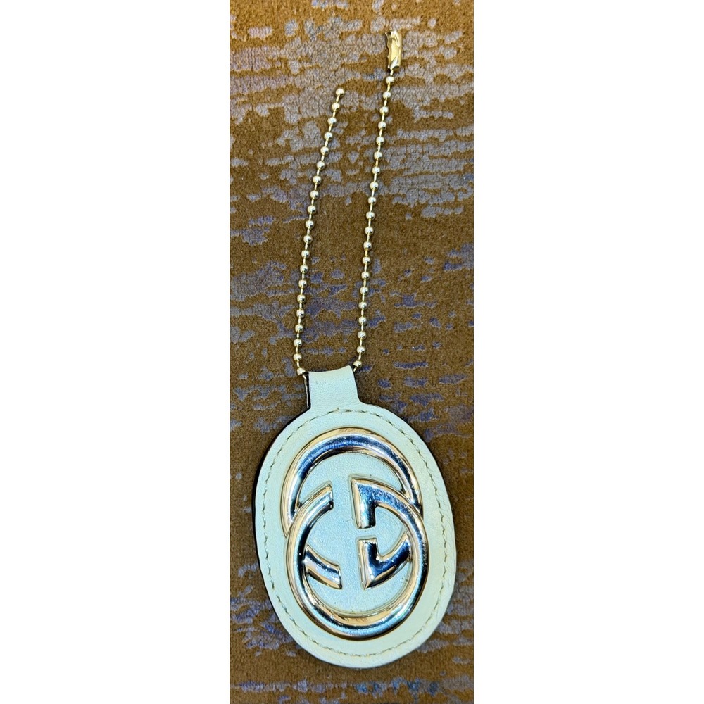 Gucci Interlocking G Leather Bag Charm Silver Tone Logo Off White Oval Keychain